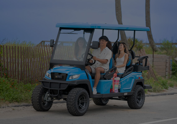 Teenagers take a ride on their bintelli electric golf cart