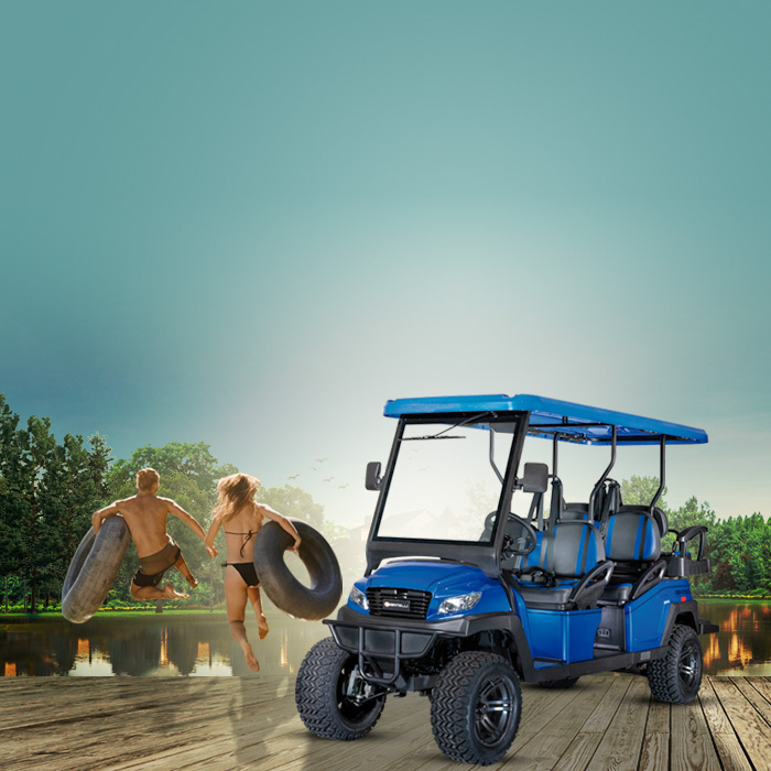 Bintelli Beyond Golf Car 4 Seater with couple jumping into lagoon