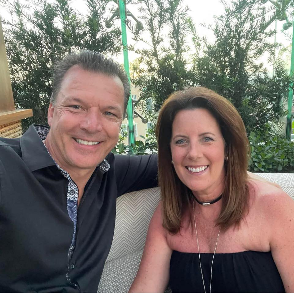 image of bintelli golf carts owner john hegedus and his wife stephanie